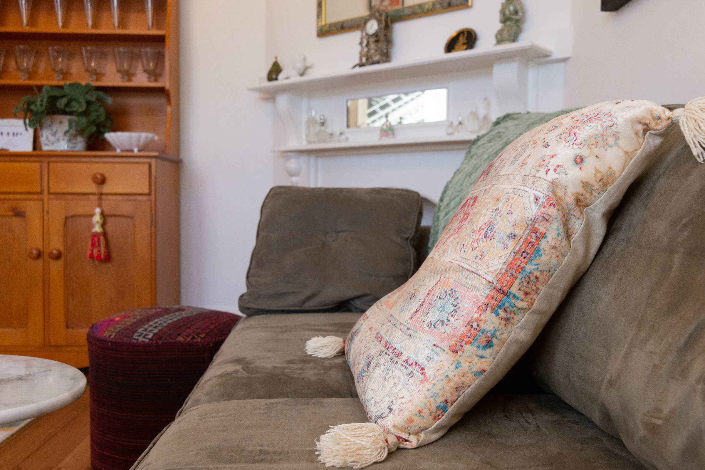 Detail of couch with cushion. Photo: Oliver Berlin.