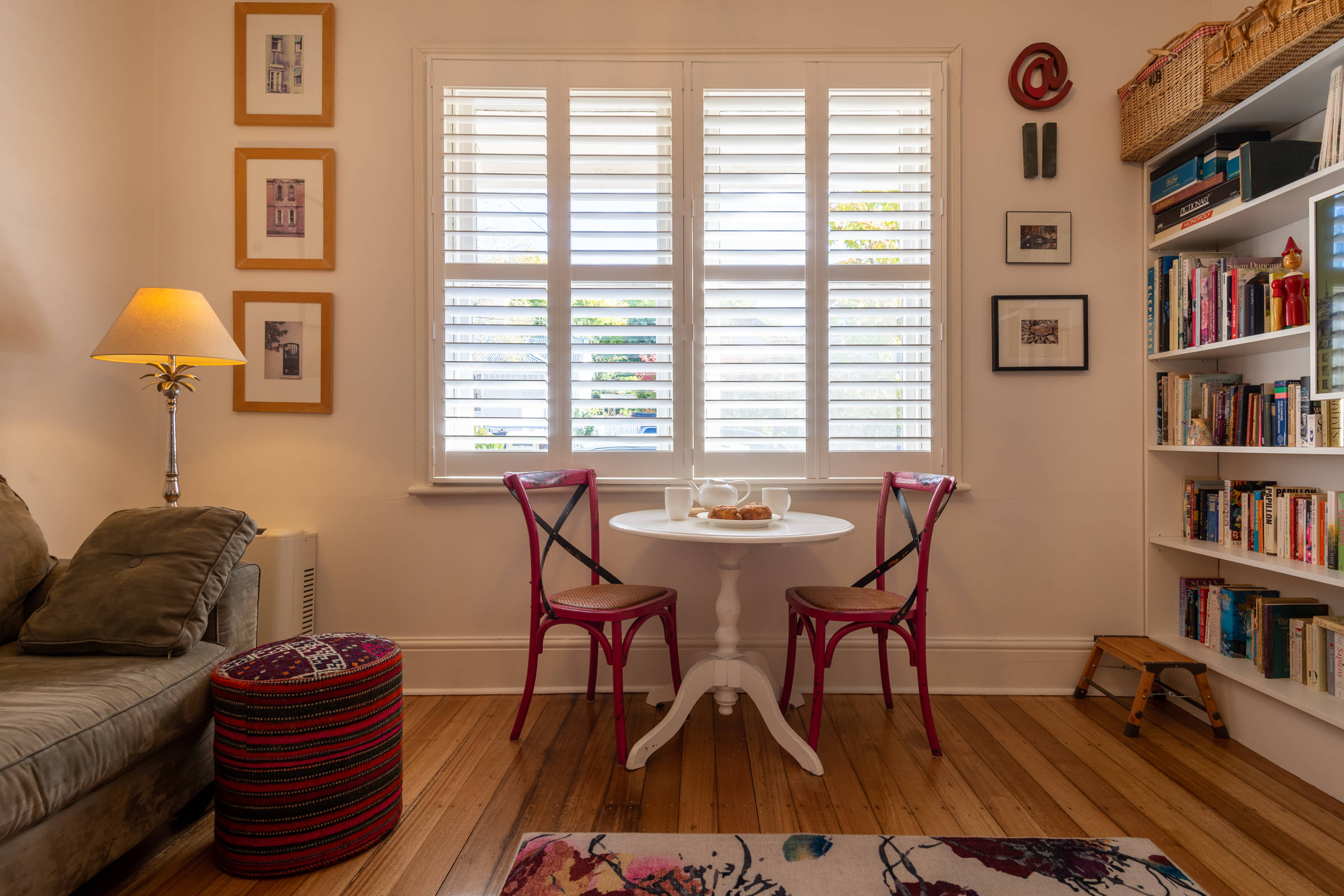 Table, chairs under window. Photo: Oliver Berlin.