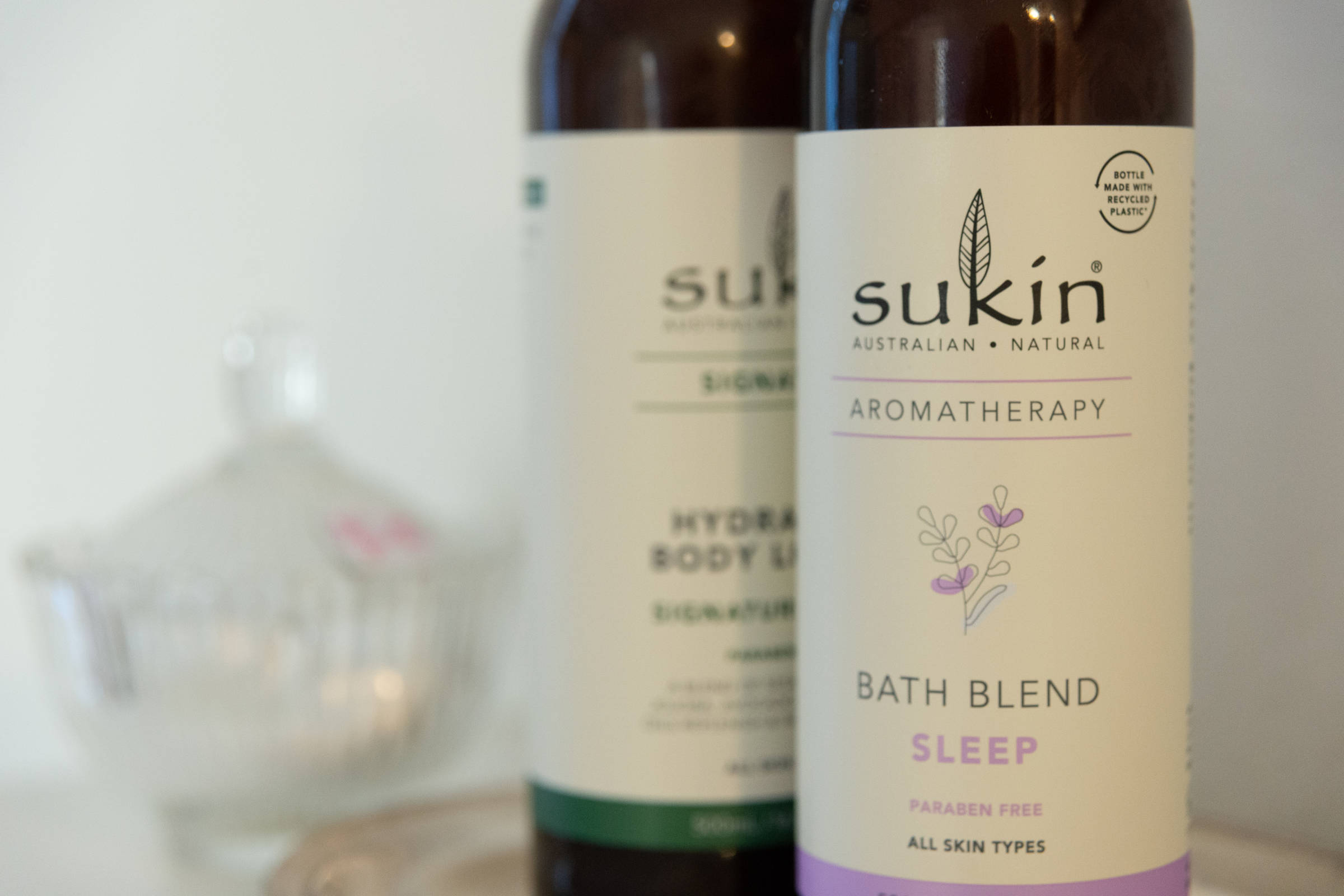 Close up of bottles on shelf and glass container. Photo: Oliver Berlin.
